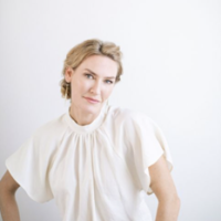 Emma Lauter in a white blouse