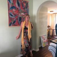 Picture of Lisa Trivell next to a painting