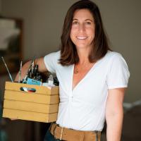 Sylvan holding a box of paint supplies