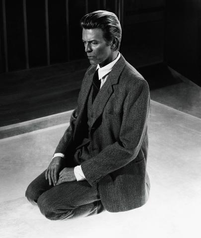 David Bowie kneeling meditating